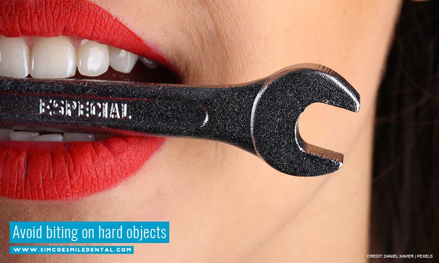 Avoid biting on hard objects