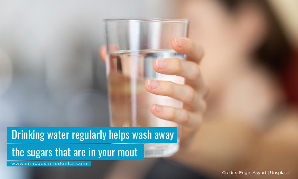 Drinking water regularly helps wash away the sugars that are in your mouth